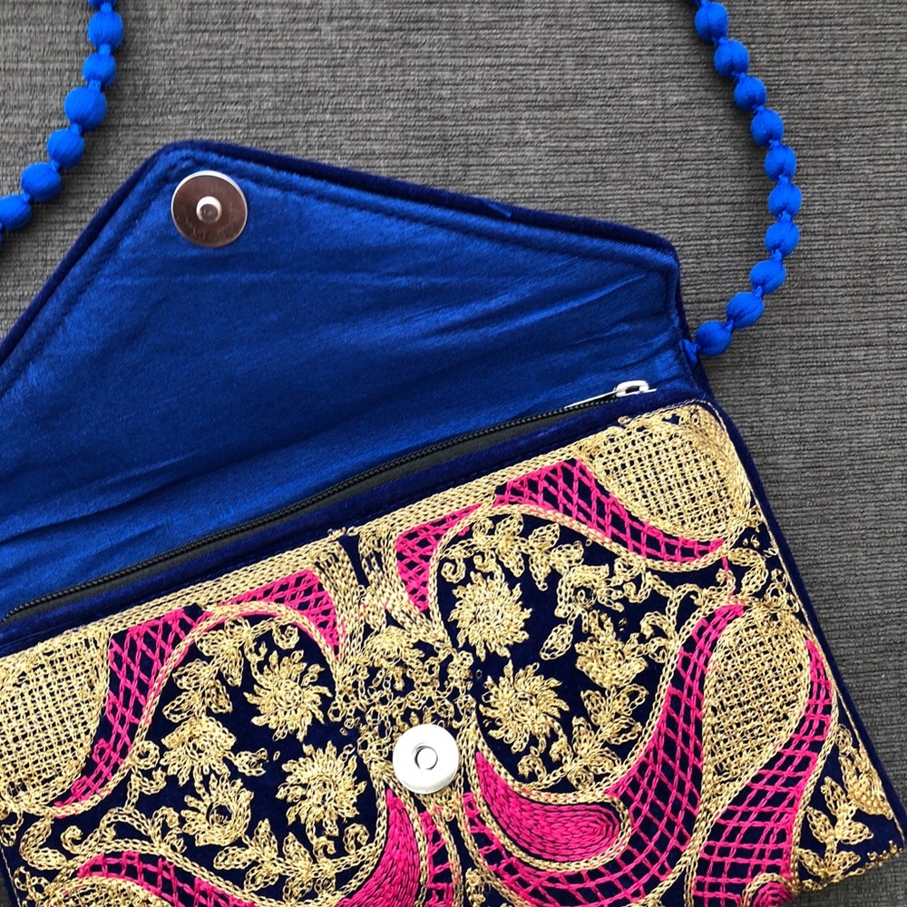 Embroidered clutch (gold/blue/pink). Made in India